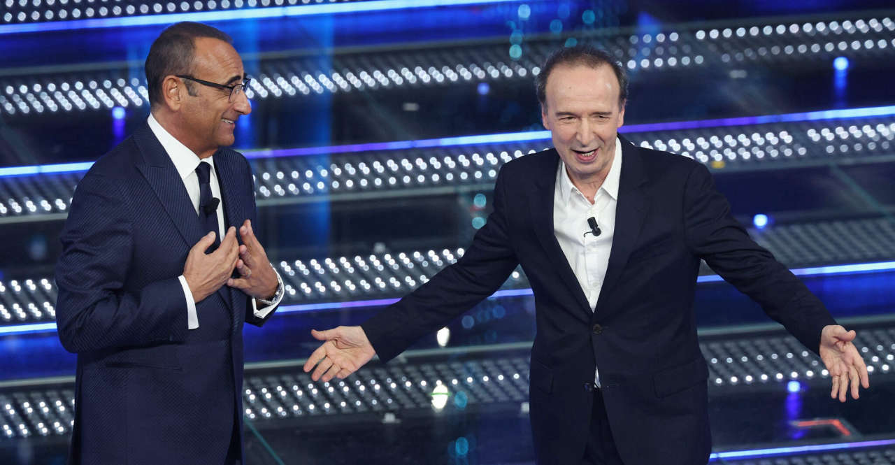 Roberto Benigni a Sanremo 2025 svela: politica assente, Elon Musk curioso e Giorgia in pole position per la vittoria