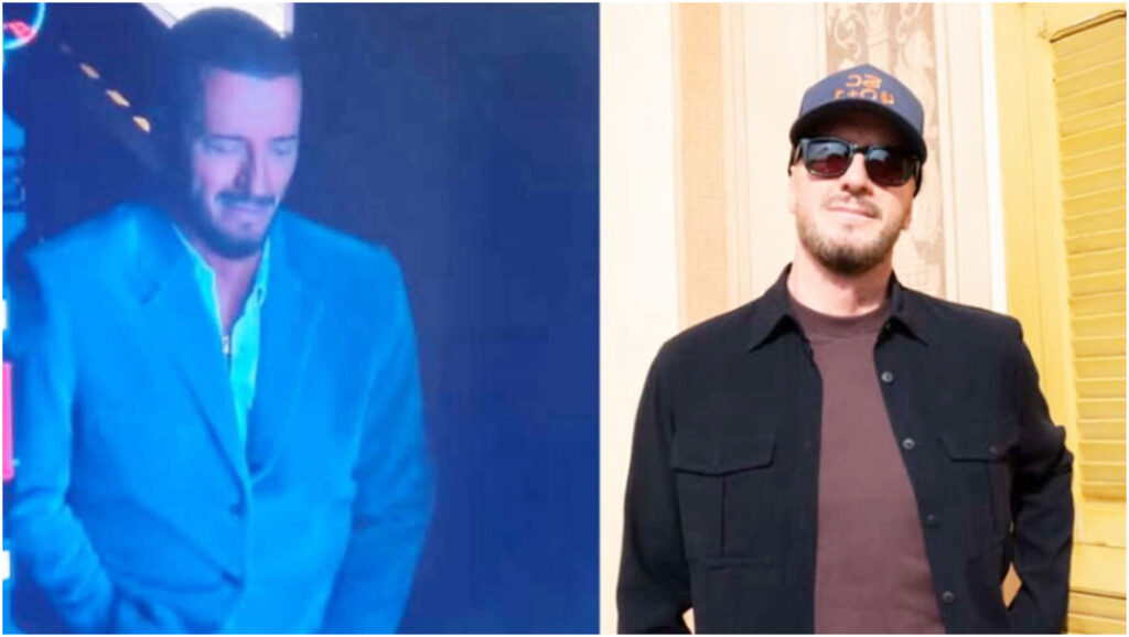 Raf si prepara per l’esibizione all’Artiston con un gesto scaramantico immortalato dalle telecamere